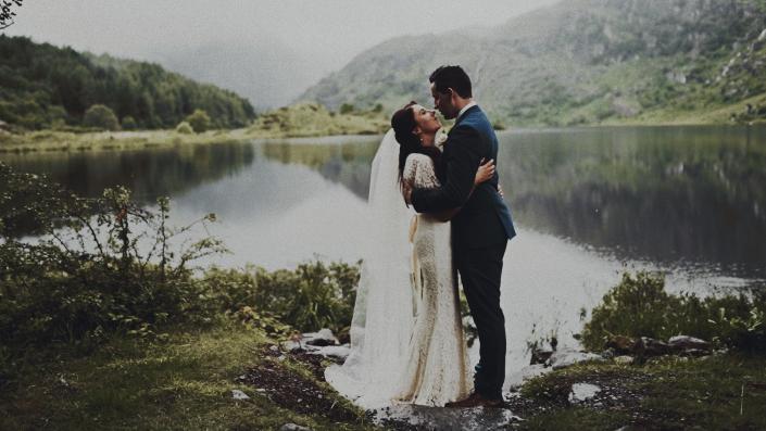 young couple with amazing mountain view in background