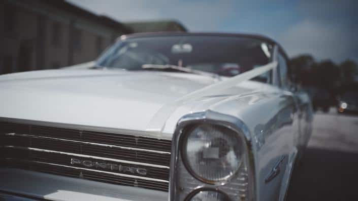 old timer car , driving do church