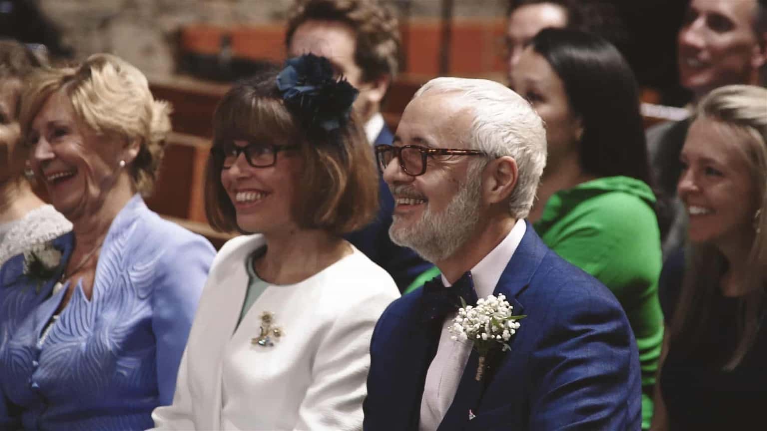 Groom parents are smiling