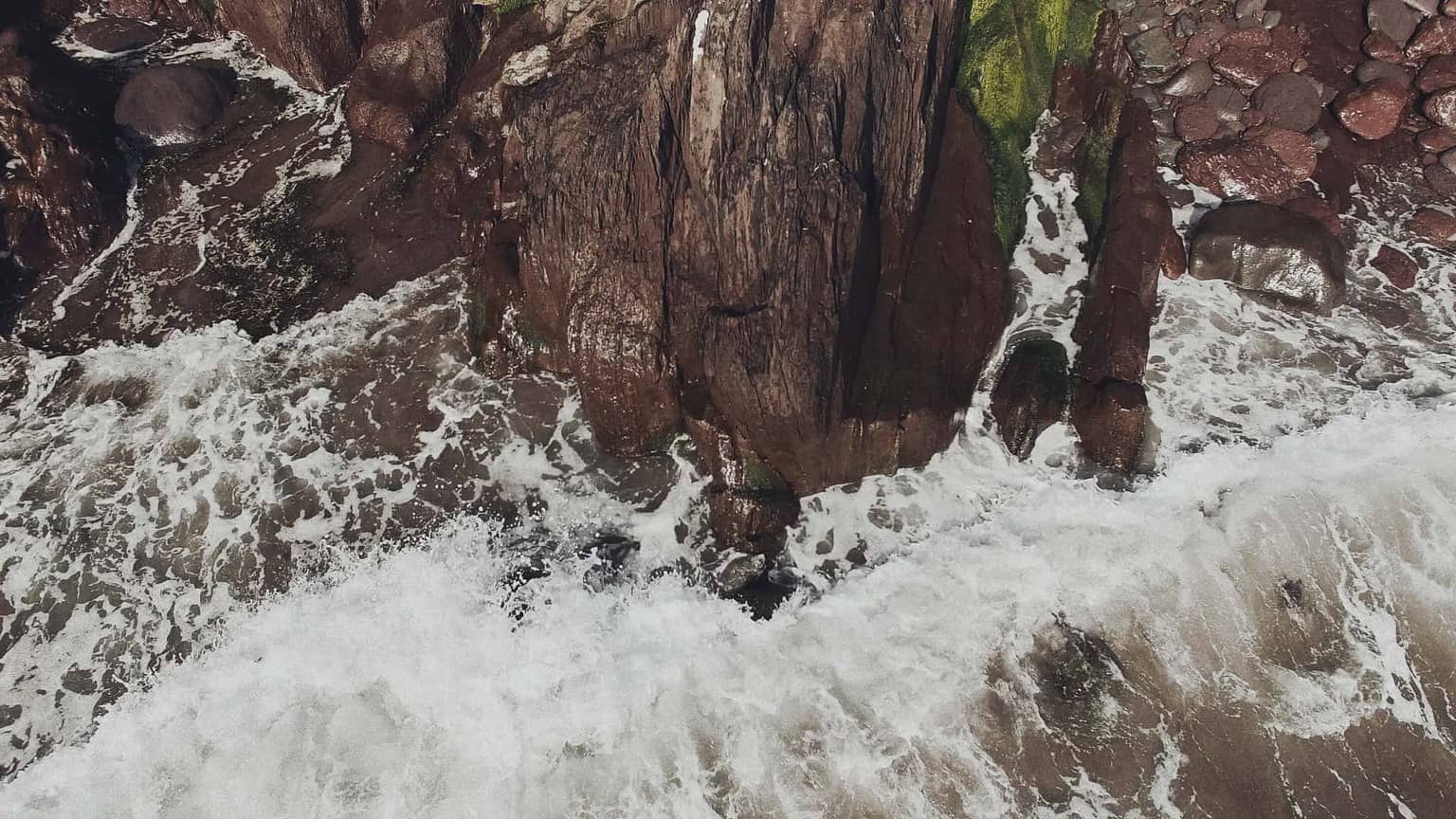 oceans waves splashing on rocks