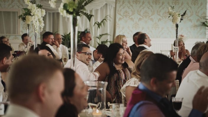 Wedding guest listening speeches