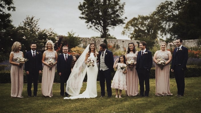bridesmaid and best mans taking pictures