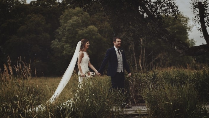 Bride and Groom walking back to venue