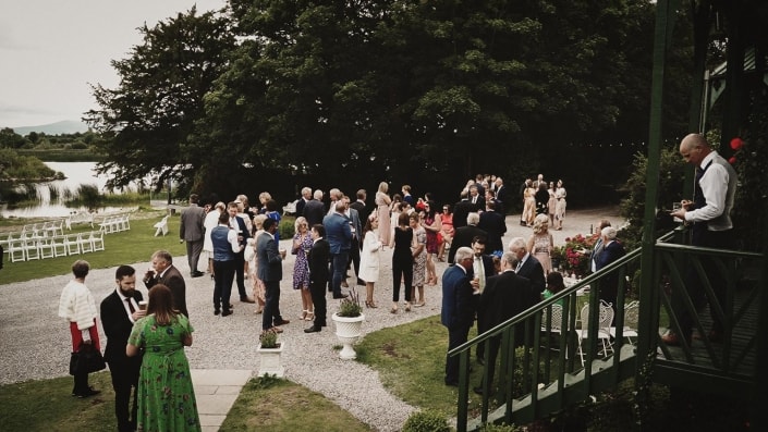Wedding guest talking and drinking happily