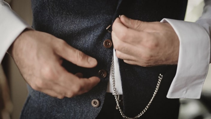 wedding watch is tided to vest