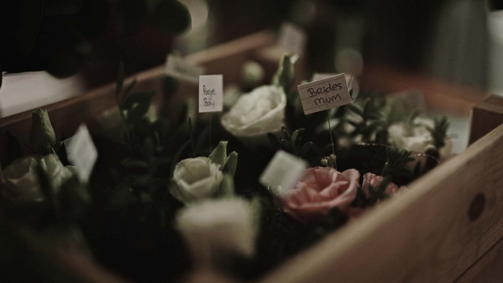 buttonhole with labels of bride mum