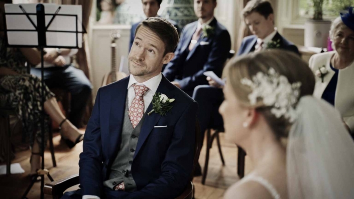 Bride with Groom listening to celebrant