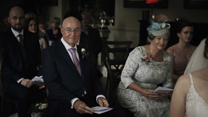 Parents of bride listening of reading