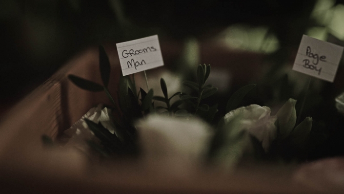 buttonhole with label of grooms man
