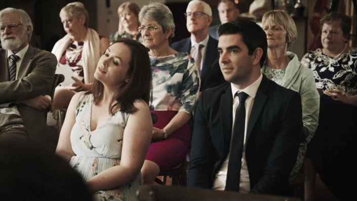 Wedding guest listening with passion
