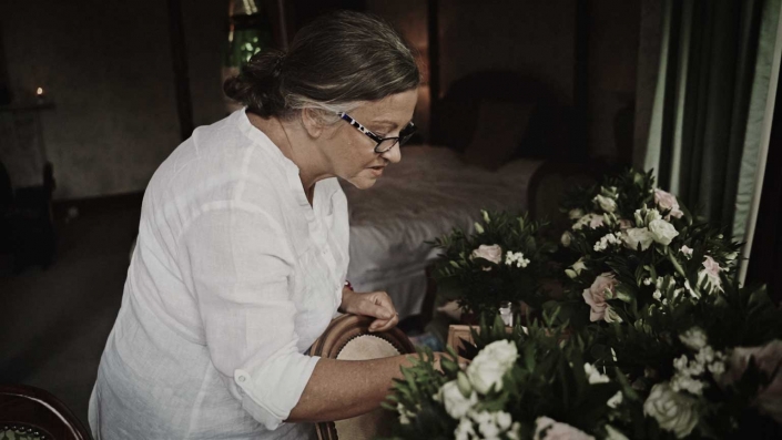 mom is checking buttonhole