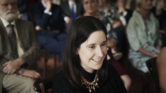 Smiling woman during ceremony