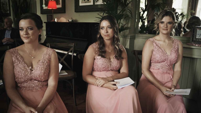 Bridesmaids watching at ceremony