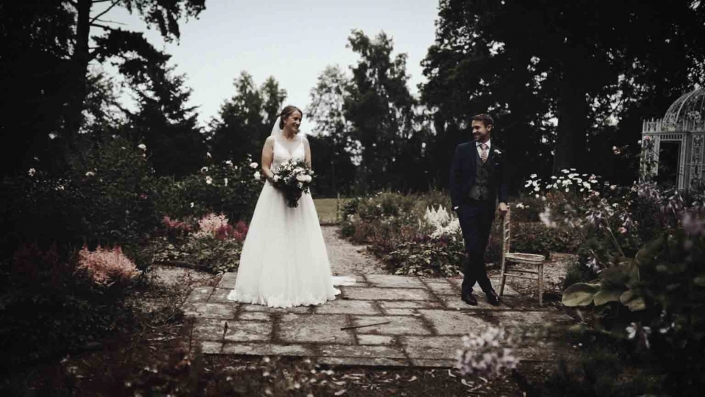 Jayne and John posing to picture in the garden