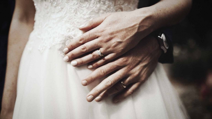 wedding rings on Jayne and John hands