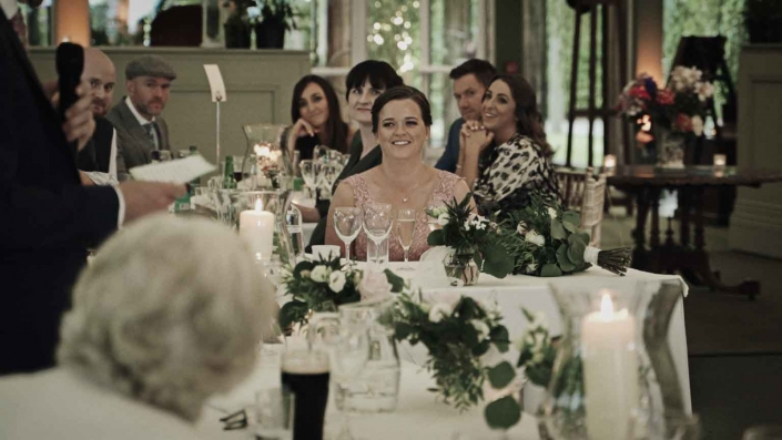 Sister of groom listening speeches