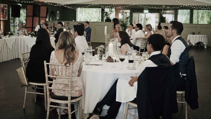 People listening groom speech