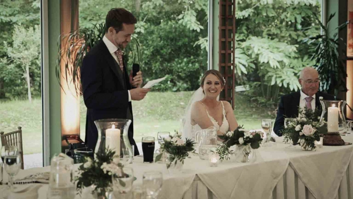Groom talking to bride