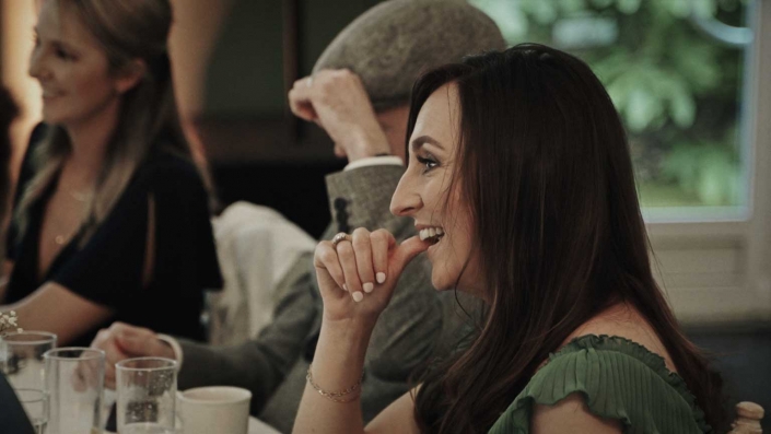 woman is smiling during speech