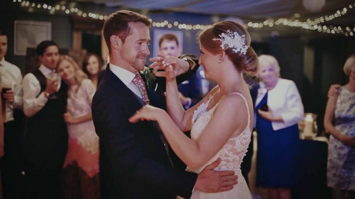 Young couple making spin during first dance
