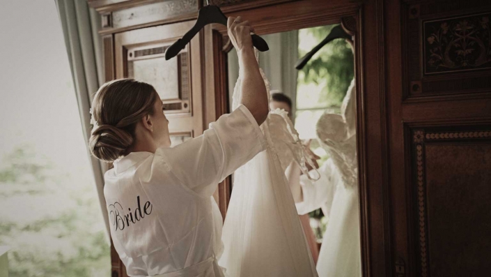 Bride is taking wedding dress