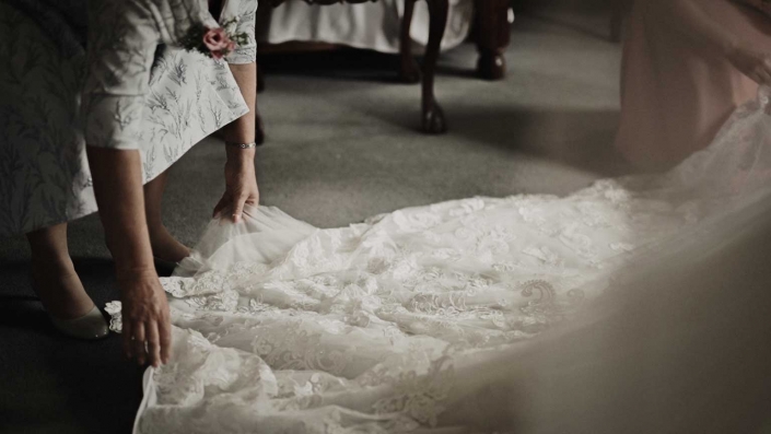 Mom is fixing the dress