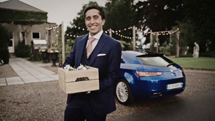 Grooms man with buttonholes