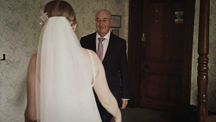 Dad is first time sees his doter in wedding dress