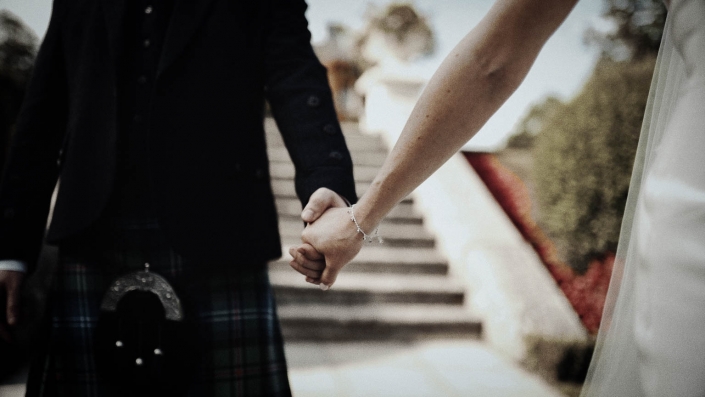 wife and husband holding hands