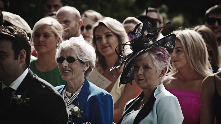 grandmother with mother looking at ceremony