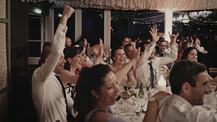 happy wedding guest are listening speeches
