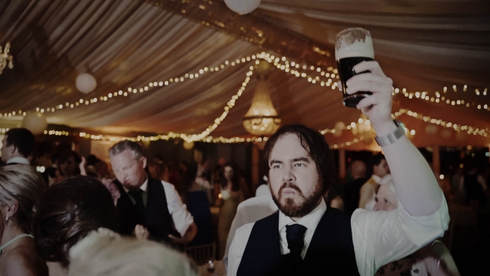 man with beer on the dance floor