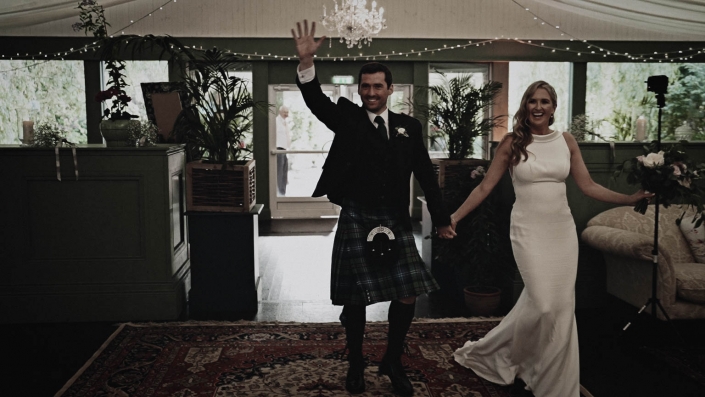 bride and groom entering the room