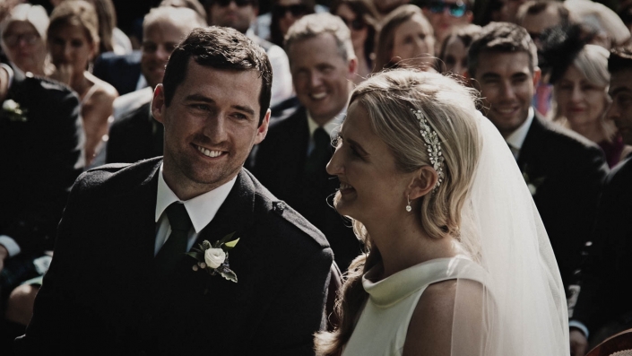 groom is smiling to bride