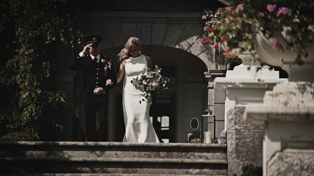 Bride with father are walking in Tinakilly House