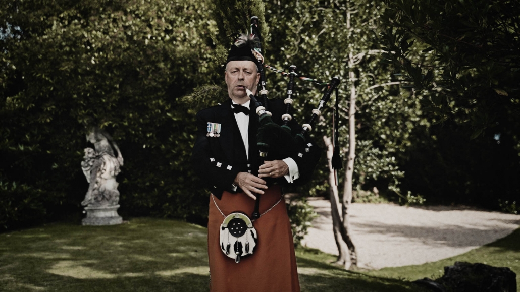 Scottish man playing on bagpipe in Tinakilly House
