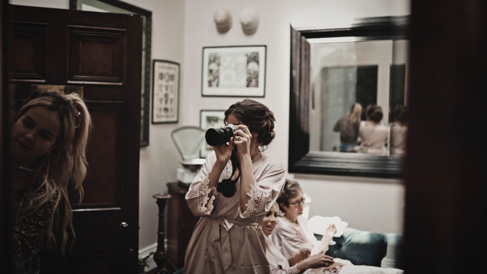 bridesmaid is making wedding photo