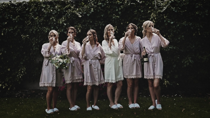 Bride with bridesmaid making picture