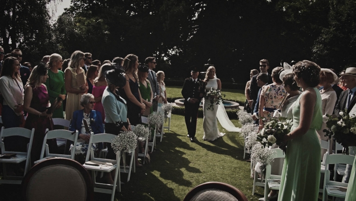 Bride wit father walking down the aisle