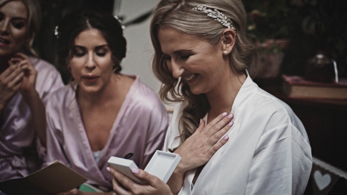 Bride watching at wedding earrings