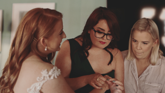 Bridesmaid helping to get ready