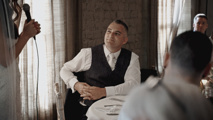 Groom listening wedding speech