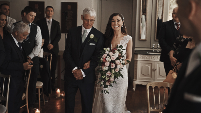 Father walking down the aisle with doter