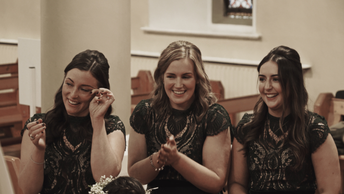 bridesmaids during wedding vows