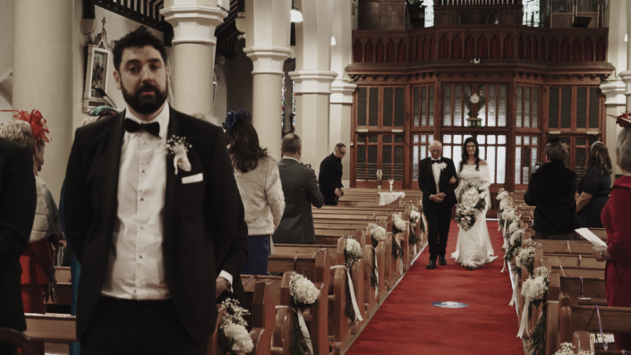 bride walking down the ail with father