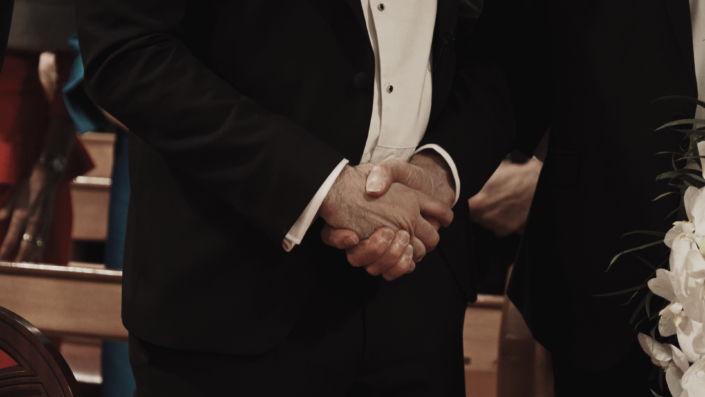 hand shake groom with father