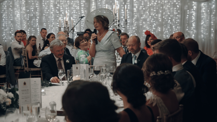 Mother of groom is delivering speeches.