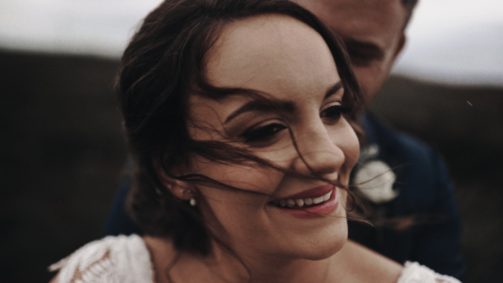 Alison wedding bride is smiling.