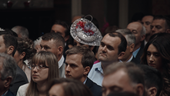 Wedding guest listening to celebrant.