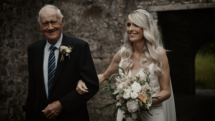 Finola with father walk down aisle